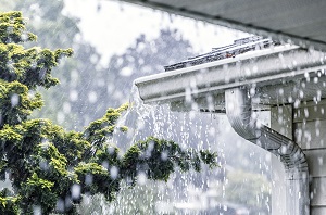 rain gutters overflowing during rain shower