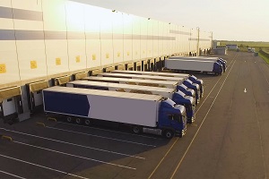 line of semi trucks outside distribution center